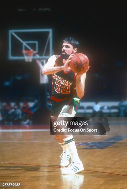 Brian Winters of the Milwaukee Bucks looks to pass the ball against the Washington Bullets during an NBA basketball game circa 1983 at the Capital...