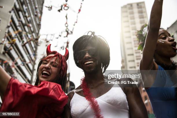 friends having fun on a carnaval celebration in brazil - halloween in sao paulo stock pictures, royalty-free photos & images