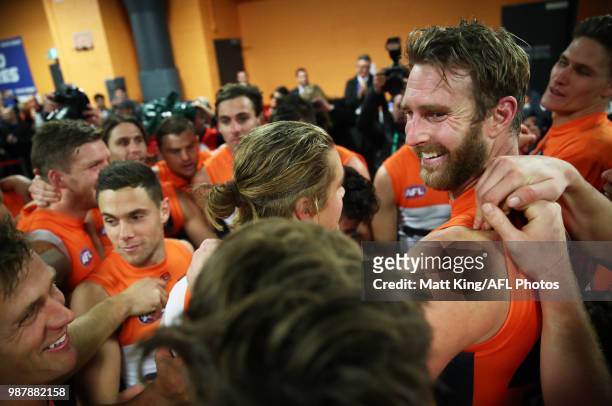 Dawson Simpson of the Giants and team mates celebrate victory after the round 15 AFL match between the Greater Western Sydney Giants and the Hawthorn...