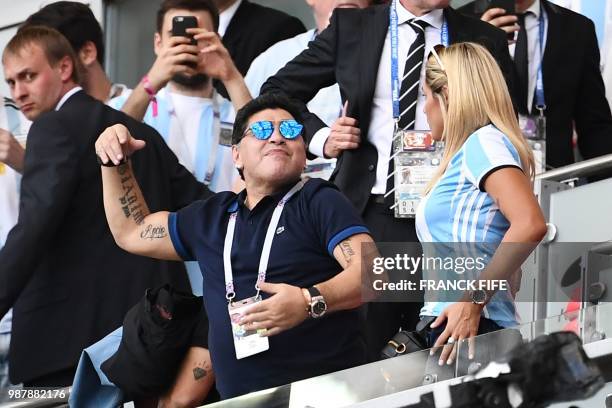 Argentinian football legend Diego Maradona celebrates after Argentina scored their first goal during the Russia 2018 World Cup round of 16 football...