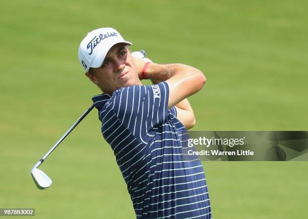 Justin Thomas of the USA plays his second shot into the first green during the third round of the HNA Open de France at Le Golf National on June 30,...