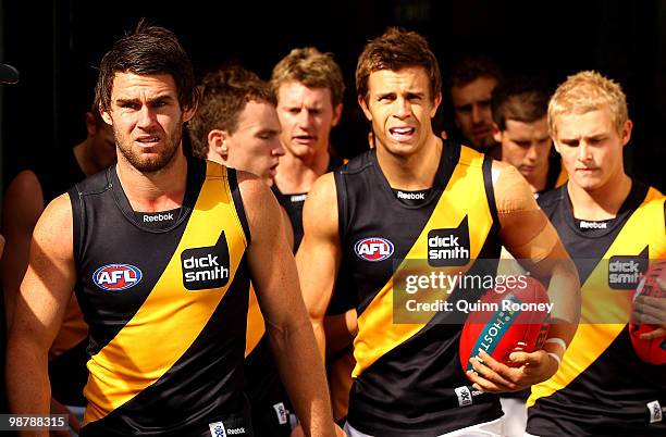 Chris Newman the captain of the Tigers leads his players out onto the ground during the round six AFL match between the Geelong Cats and the Richmond...