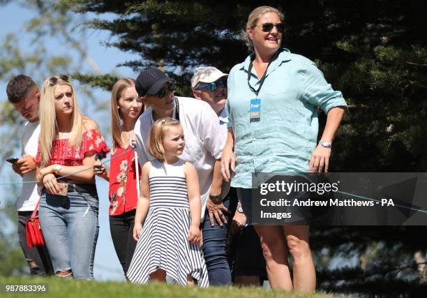 Zara Tindall and her daughter Mia watch Mike Tindall's tee shot on the fourth hole during the Celebrity Cup charity golf tournament at The Celtic...