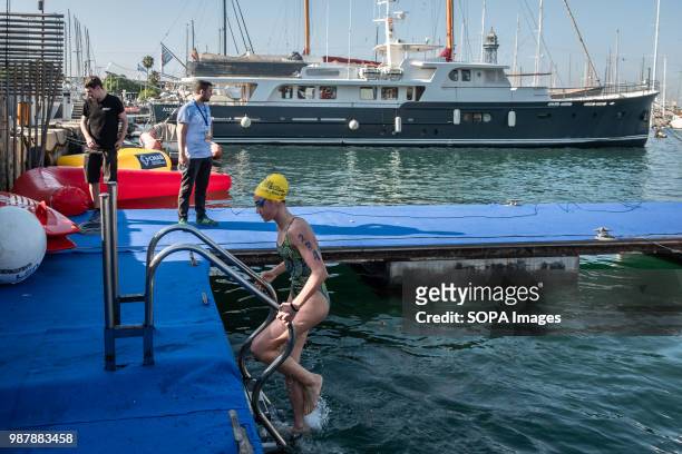 Swimmer is seen after finishing her series. The 91A across the port of Barcelona involves different sports club in the city of Barcelona and includes...