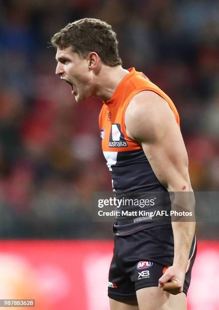 Jacob Hopper of the Giants celebrates a goal during the round 15 AFL match between the Greater Western Sydney Giants and the Hawthorn Hawks at...