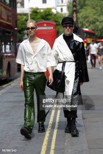 Digital Influencer Mikko Puttonen wears a Hugo by Hugo Boss top, Adieu shoes, Joshua Millard trousers and vintage sunglasses with Digital Influencer...