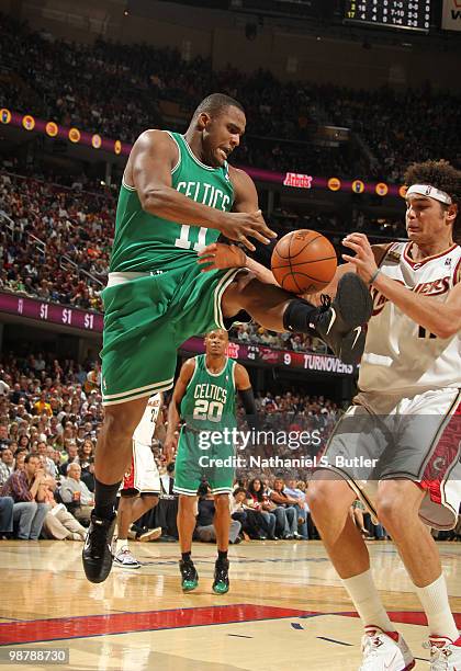 Anderson Varejao of the Cleveland Cavaliers fights for a loose ball against Glen Davis of the Boston Celtics in Game One of the Eastern Conference...