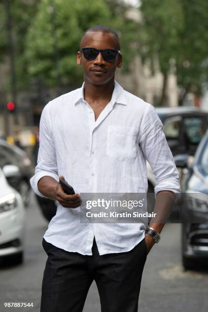 Ballet dancer Eric Underwood wears Kilgor trousers, Frescobol Carioca shirt and Jimmy Choo sunglasses during London Fashion Week Men's on June 10,...