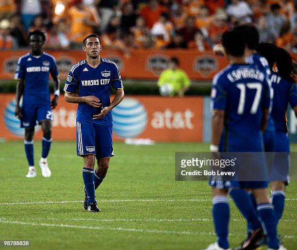 Davy Arnaud of the Kansas City Wizards leaves the field after receiving a red card ejection for serious foul play against goalkeeper Pat Onstad of...