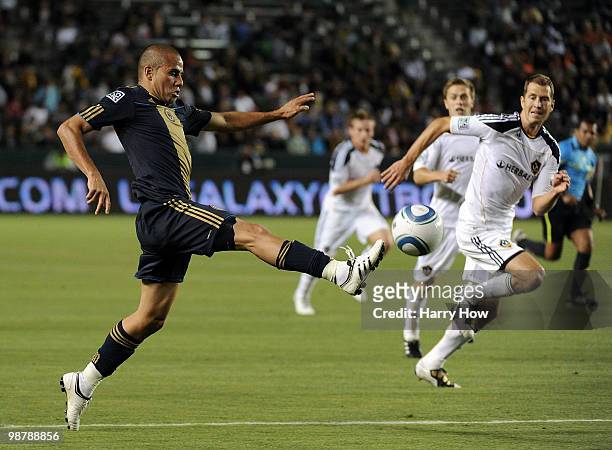 Fred of the Philadelphia Union takes a pass in front of Gregg Berhalter of the Los Angeles Galaxy during the first half at the Home Depot Center on...