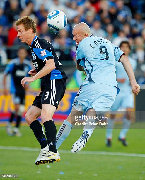 Conor Casey of the Colorado Rapids twists for a shot on goal off his header against Chris Leitch of the San Jose Earthquakes in the first half on May...