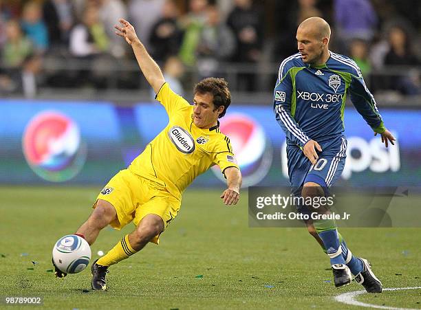 Guillermo Barros Schelotto of the Columbus Crew battles Freddie Ljungberg of the Seattle Sounders FC on May 1, 2010 at Qwest Field in Seattle,...