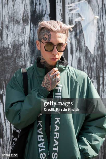 Global Digital director and model Chris Lavish wears Yohji Yamamoto sunglasses, Fifty Karats jacket during London Fashion Week Men's on June 10, 2018...