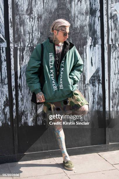 Global Digital director and model Chris Lavish wears Yohji Yamamoto sunglasses, Fifty Karats jacket during London Fashion Week Men's on June 10, 2018...