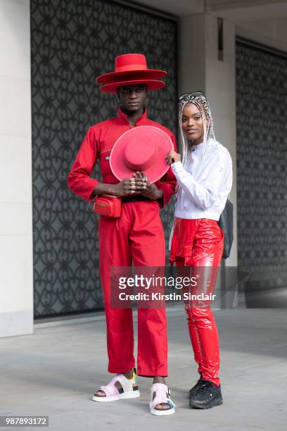 Creative Director and stylist Abdel Keita Tavares wears Doc Martens sandals, Dickies boiler suit and his own design hats with Fashion designer...