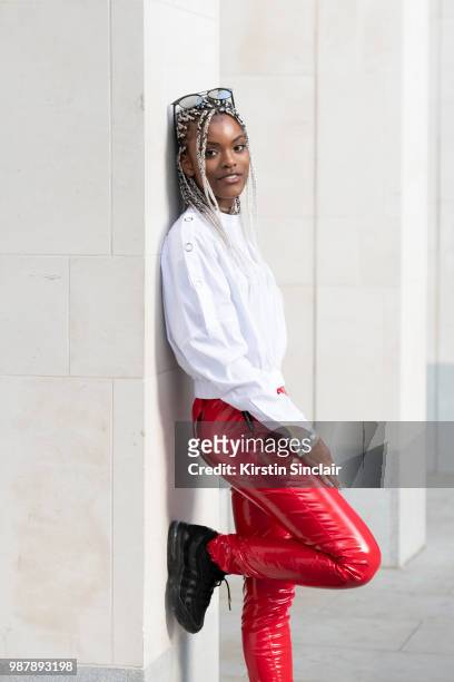 Fashion designer Shanice Palmer wears all her own design clothing during London Fashion Week Men's on June 10, 2018 in London, England.