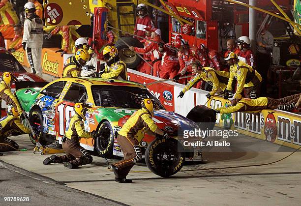 Kyle Busch, driver of the M&M's Toyota, pits during the NASCAR Sprint Cup Series Crown Royal Presents the Heath Calhoun 400 at Richmond International...