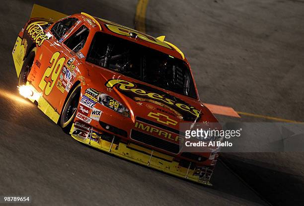 Kevin Harvick, driver of the Reese's Chevrolet races during the NASCAR Sprint Cup Series Crown Royal Presents the Heath Calhoun 400 at Richmond...