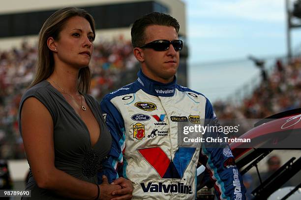 Allmendinger, driver of the Valvoline Ford, stands on the grid with his wife Lynne Allmendinger during the NASCAR Sprint Cup Series Crown Royal...