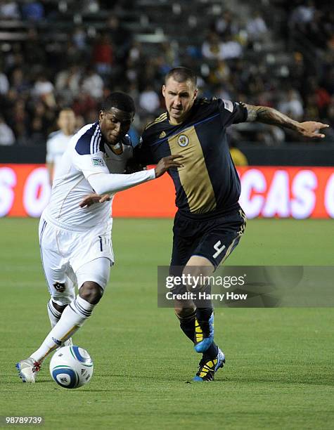 Edson Buddle of the Los Angeles Galaxy and Danny Califf of the Philadelphia Union battle for position during the second half at the Home Depot Center...