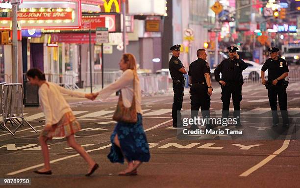 Police keep watch in Times Square after an incident involving a suspicious vehicle caused authorities to shut down parts of Times Square May 1, 2010...
