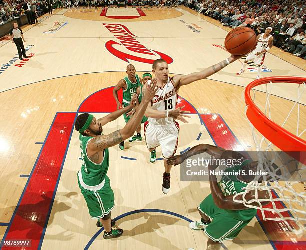 Delonte West of the Cleveland Cavaliers shoots against Rasheed Wallace and Kendrick Perkins of the Boston Celtics in Game One of the Eastern...