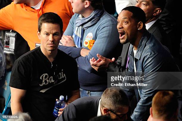 Actor Mark Wahlberg talks with actor Will Smith before the start of the Floyd Mayweather Jr. And Shane Mosley welterweight fight at the MGM Grand...