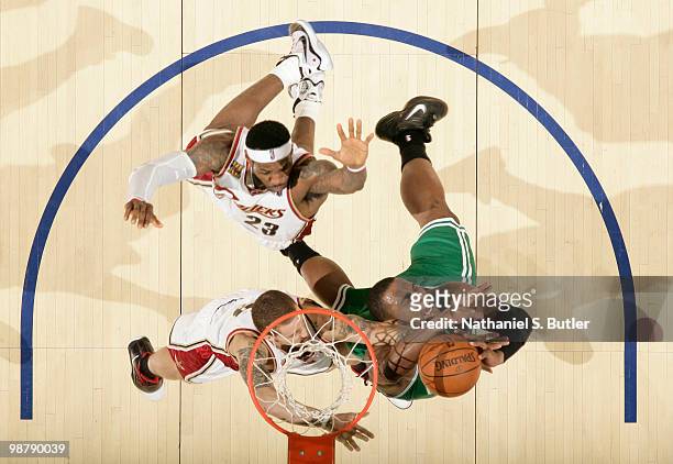 Glen Davis of the Boston Celtics shoots against Delonte West and LeBron James of the Cleveland Cavaliers in Game One of the Eastern Conference...