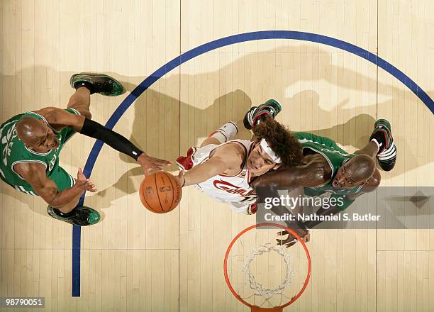 Anderson Varejao of the Cleveland Cavaliers rebounds against Kevin Garnett and Ray Allen of the Boston Celtics in Game One of the Eastern Conference...