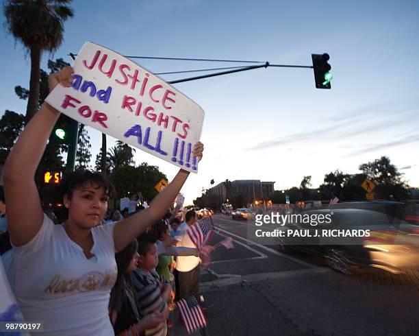 Protestors line the city streets around the Arizona State Capitol as they rally against the State Senate bill 1070 May 1 at sunset. AFP Photo/Paul J....