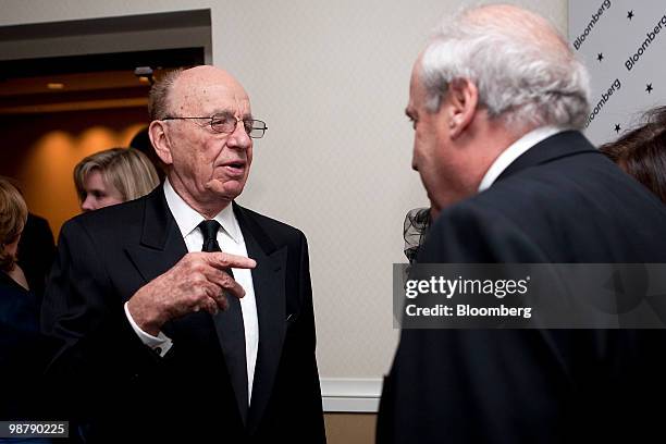 Rupert Murdoch, chairman and chief executive officer of News Corp., left, attends a Bloomberg cocktail party prior to the White House Correspondents'...