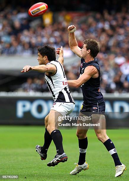 Paul Medhurst of the Magpies competes with Bryce Gibbs of the Blues during the round six AFL match between the Carlton Blues and the Collingwood...