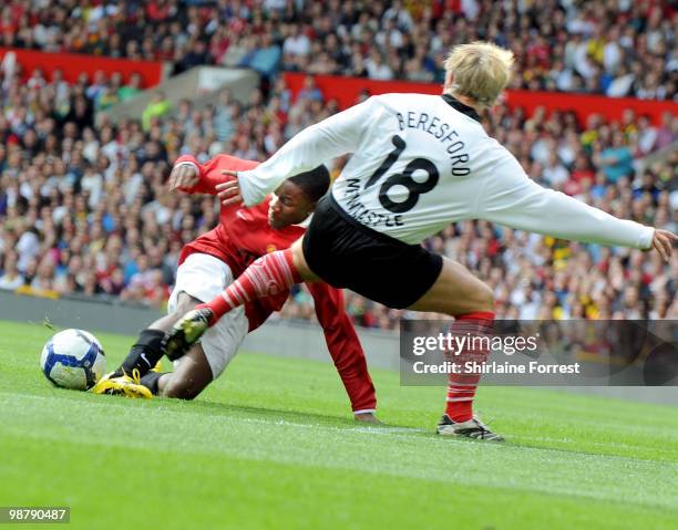 Tinchy Stryder and John Beresford play football at United For Relief: The Big Red Family Day Out at Old Trafford on May 1, 2010 in Manchester,...