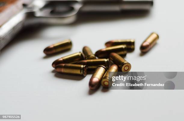 gun and bullets - ammunition stock-fotos und bilder