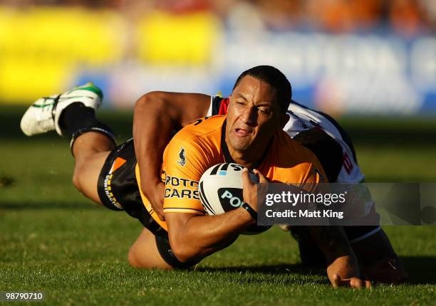 Benji Marshall of the Tigers is tackled by Frank Paul Nuuausala of the Roosters in the dying seconds to save a try during the round eight NRL match...