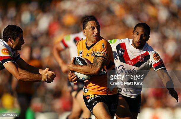 Benji Marshall of the Tigers makes a break in the dying seconds during the round eight NRL match between the Wests Tigers and the Sydney Roosters at...