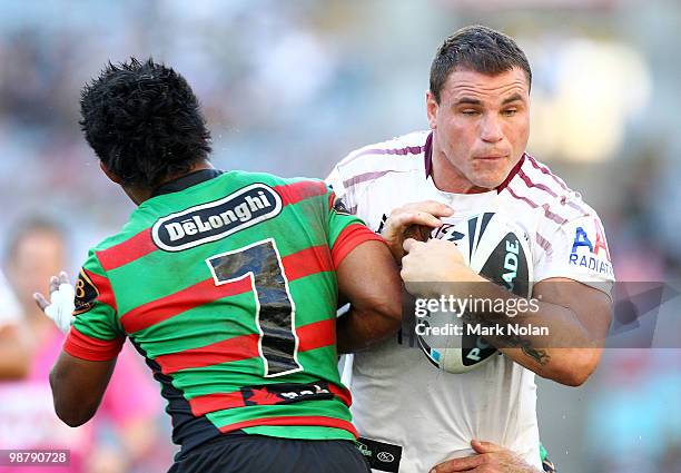 Chris Sandow of the Rabbitohs tackles Anthony Watmough of the Eagles during the round eight NRL match between the South Sydney Rabbitohs and the...