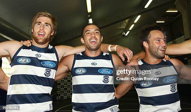 Tom Lonergan, James Podsiadly and Jimmy Bartel of the Cats sing the song in the rooms after winning the round six AFL match between the Geelong Cats...