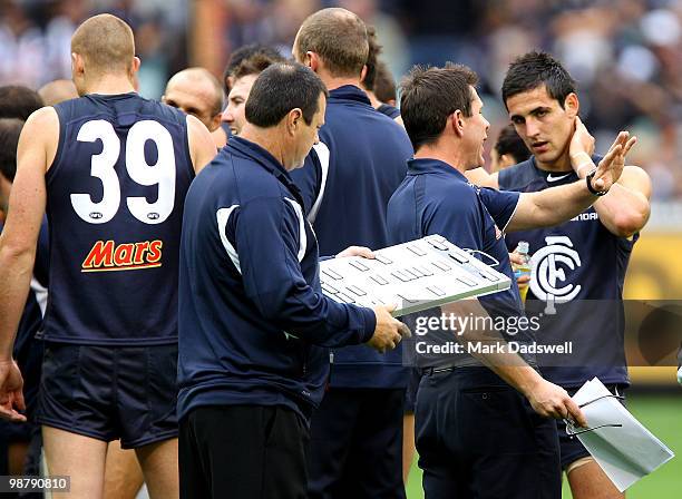 Brett Ratten coach of the Blues addresses his players during the round six AFL match between the Carlton Blues and the Collingwood Magpies at...