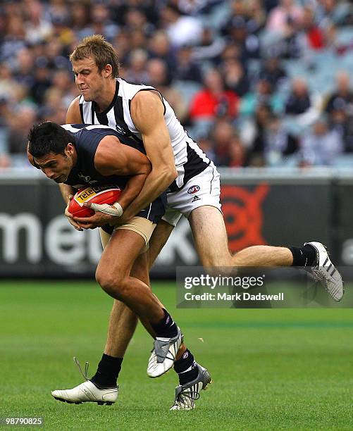 Setanta O'hAilpin of the Blues is tackled during the round six AFL match between the Carlton Blues and the Collingwood Magpies at Melbourne Cricket...