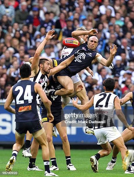 Chris Judd of the Blues flies for a mark during the round six AFL match between the Carlton Blues and the Collingwood Magpies at Melbourne Cricket...