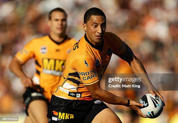 Benji Marshall of the Tigers shapes to pass during the round eight NRL match between the Wests Tigers and the Sydney Roosters at Campbelltown Sports...