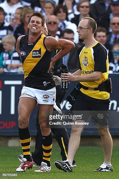 Ben Cousins of the Tigers is seen to by a trainer during the round six AFL match between the Geelong Cats and the Richmond Tigers at Skilled Stadium...