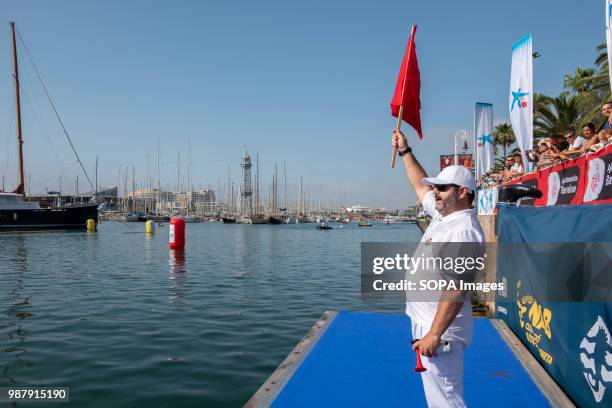 One of the referees of the competition is seen during the competition. The 91A across the port of Barcelona involves different sports club in the...