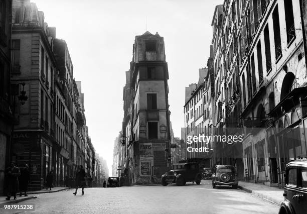 Car drives between Clery street and Beauregard street in Paris on March 21, 1947.