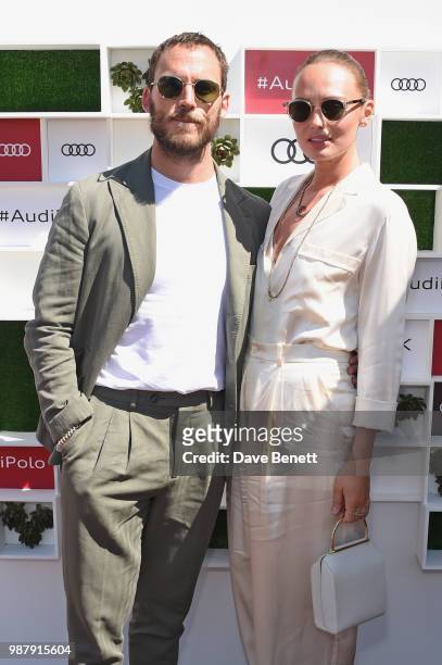 Sam Claflin and Laura Haddock attend the Audi Polo Challenge at Coworth Park Polo Club on June 30, 2018 in Ascot, England.