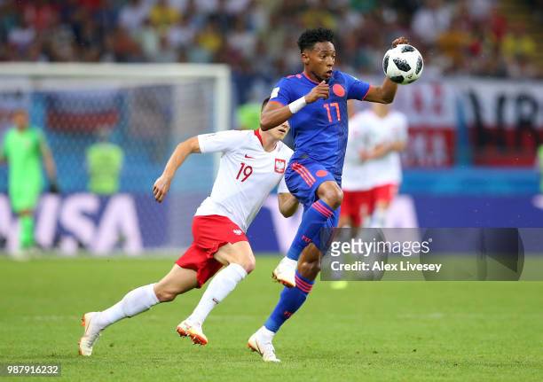 Johan Mojica of Colombia wins the ball ahead of Piotr Zielinski of Poland during the 2018 FIFA World Cup Russia group H match between Poland and...