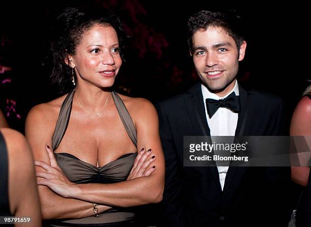 Actor Adrian Grenier of the television show "Entourage," right, and actress Gloria Reuben attend the Bloomberg Vanity Fair White House...