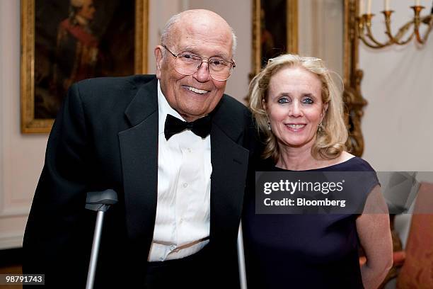 Representative John Dingell, a Democrat from Michigan, left, and his wife Debbie attend the Bloomberg Vanity Fair White House Correspondents'...