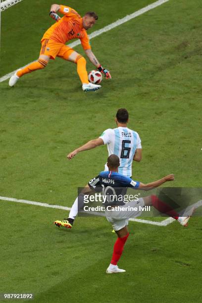 Kylian Mbappe of France scores past Franco Armani of Argentina his team's third goal during the 2018 FIFA World Cup Russia Round of 16 match between...